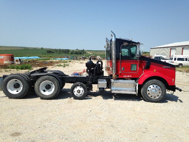 Kenworth T800 tractor in-profile side view showing cab and chassis with dual rear axles and exhaust stack.