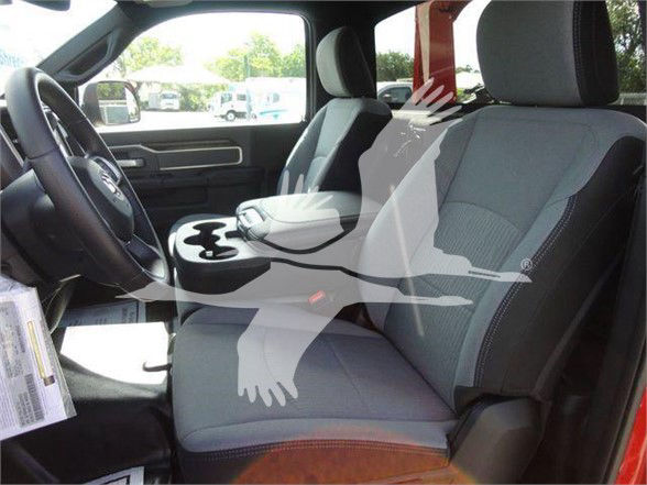 Ram 4500 SLT truck interior showing front seats and center console with cupholders.