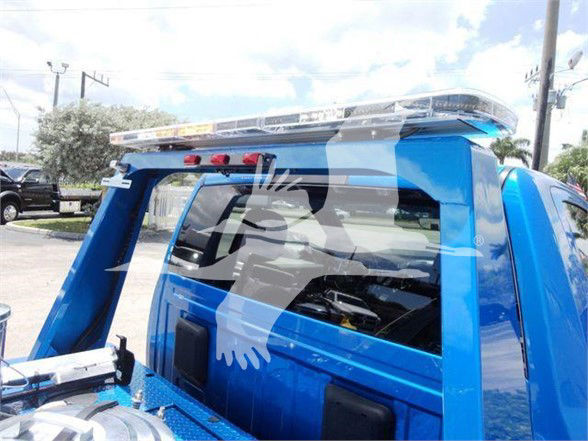 Ram 4500 truck night cap with blue body and towing equipment visible in truck bed area.