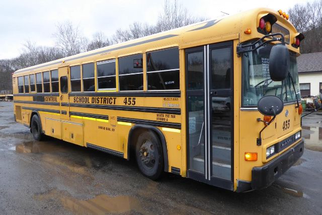 School district yellow bus with door open, bus number 455 on front, text reading CENTRAL SCHOOL DISTRICT 455 along side, and 'SEATS 72' near rear window.
