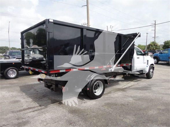 Truck in service body rear view showing refuse body and white cab, Silverado 5500HD