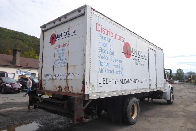 2004 Freightliner M2 106 box truck rear and right side panels with VYUN CO. branding and distributors text.