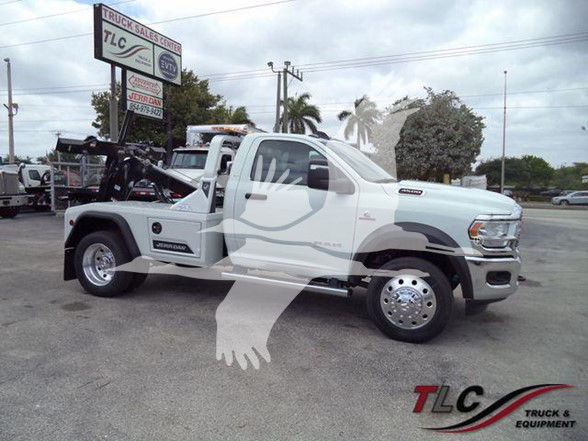 2024 Ram 4500 SLT tow truck with crane equipment and hydraulic bed, white color, side view showing dual rear wheels, TLC Truck & Equipment logo.