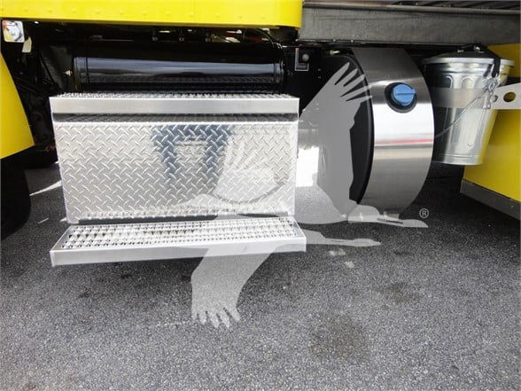 Peterbilt 337 truck step and fuel/auxiliary tanks with diamond plate toolbox and side-mounted cylindrical tank visible.