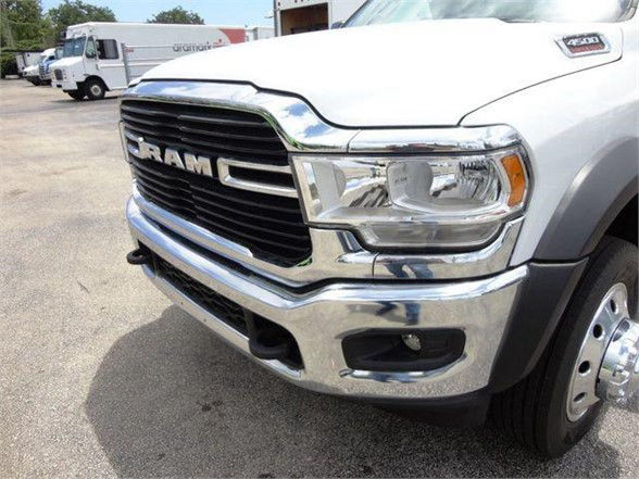 Ram 4500 front grille and bumper with chrome finish, RAM lettering on black grille, headlight assembly, and part of front wheel.