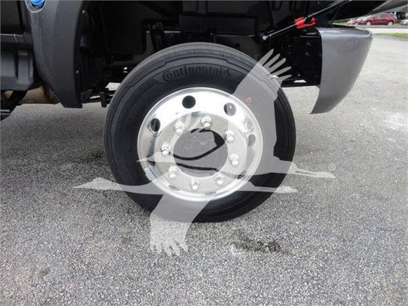 Continental tire on front wheel of a 2023 International CV truck showing steel wheel with lug nuts and hub.