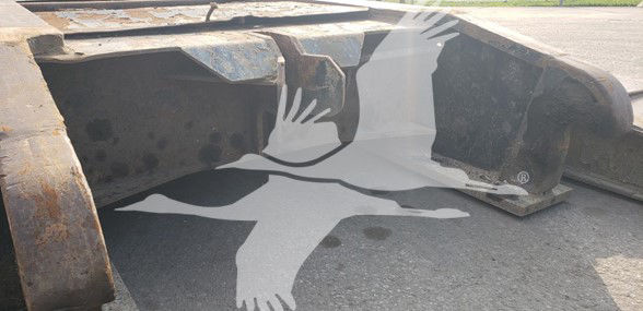 Attachment shows underside of a Fontaine 55 Ton lowboy trailer with drop side rails and rusted steel components.