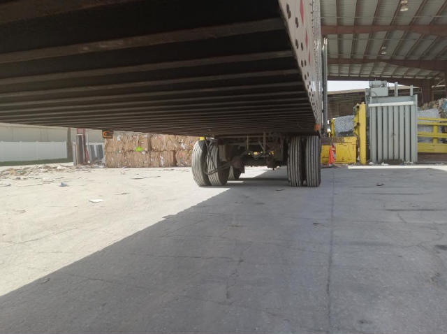 Trailer underside and wheels of a Vanguard VXP trailer, view from ground level showing axles and tires.