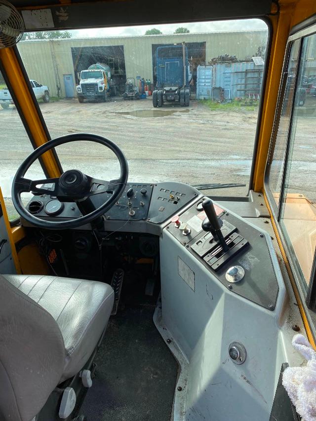 Ottawa yard spotter interior cockpit showing steering wheel, control panel, and gear lever with multiple switches.