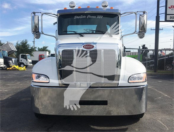 Peterbilt 337 front view showing large chrome grille, bumper, and windshield with text 'SuperSide Classic 337' on the top and a Peterbilt emblem on the grille.