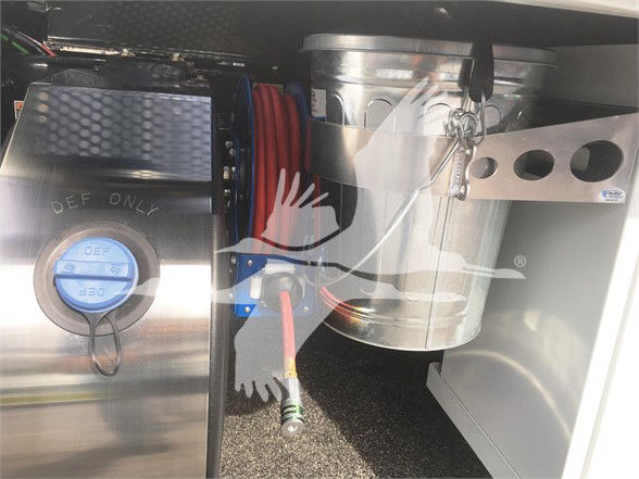 Peterbilt 337 truck component image showing fuel cap and cylindrical metallic components, hoses, and electrical wiring in a truck bed area.