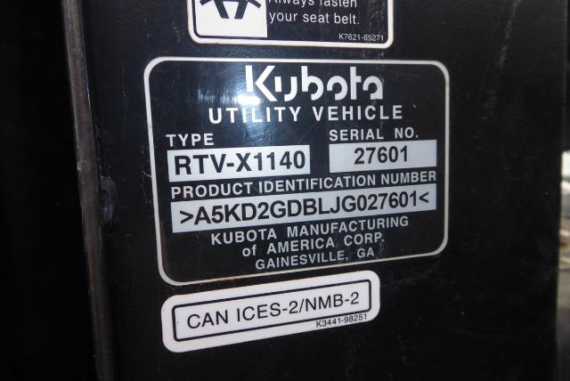 Kubota RTV-X1140 utility vehicle identification plate showing TYPE RTV-X1140 and SERIAL NO. 27601 with VIN/PI numbers and CAN ICES-2/NMB-2 label.