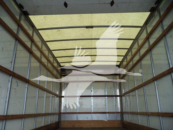 No visible engine or labels in this image; interior of a truck cargo box with metal walls and wooden floor supports.