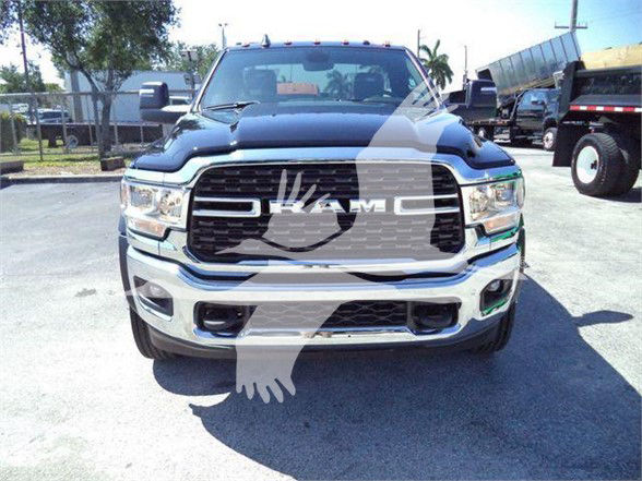Front view of a 2024 Ram 5500 SLT truck showing RAM grille and bumper.