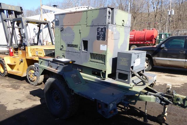 MEP-804A on trailer showing military camouflage generator unit and control panel on side.
