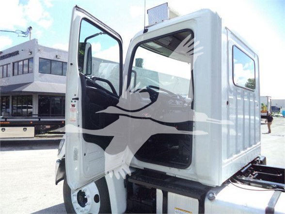Hino 268A cab and cargo area with open driver door showing interior and step.