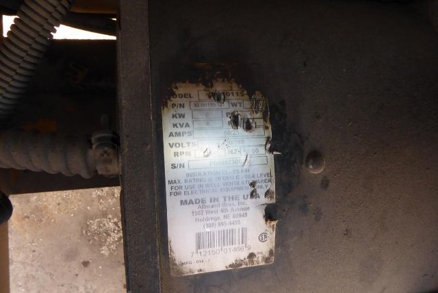 Label on Allmand Night Lite Pro showing model/serial plate with electrical specs and Made in USA text.