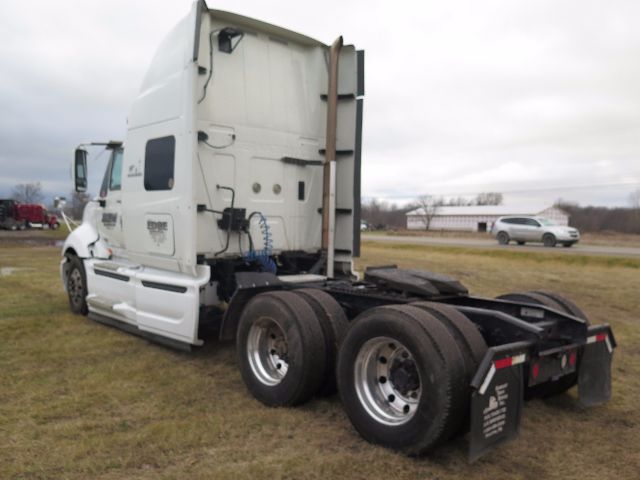International PROSTAR truck rear view showing sleeper cab and dual rear axles.