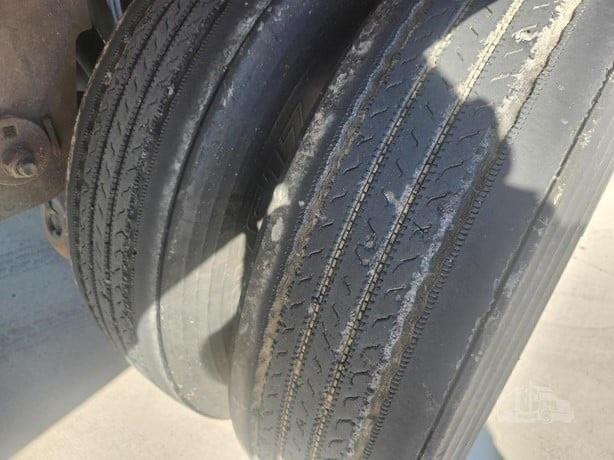 Tire showing tread on utility reefer trailer wheel; some wear visible.
