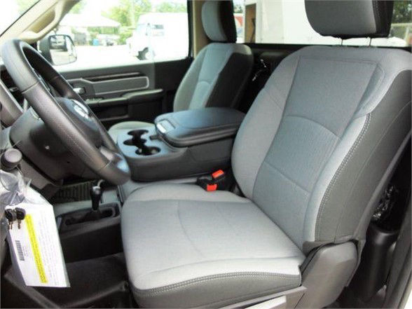 Interior view of a 2024 Ram 4500 SLT front seats and dashboard.