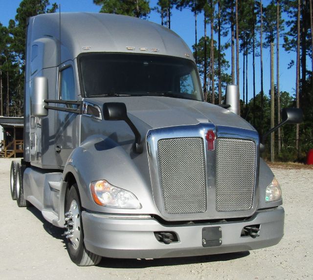 Kenworth T680 cab and chassis front view showing grille and headlights.