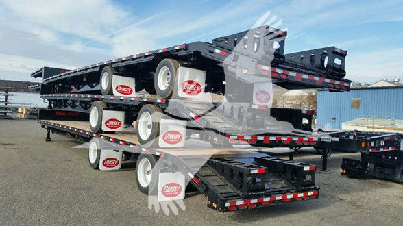 Beavertail trailer stack showing Dorsey logo on rims and tie-down points; stacked flatbed trailers with expandables and rear ramps.