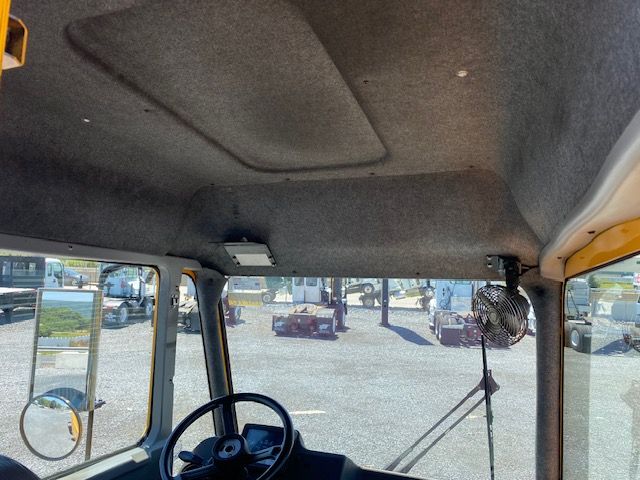 Cab interior of a 2017 Ottawa T2 truck showing steering wheel and roof panels.