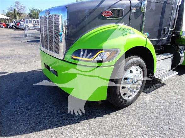 Front-left view of a green-and-silver 2022 Peterbilt 337 truck with chrome grille, headlight, and front wheel. Peterbilt emblem visible on grille.