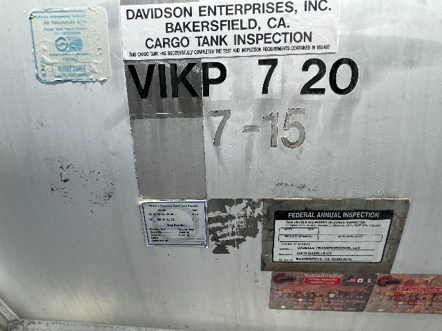 Trailer side with labels: DAVIDSON ENTERPRISES, INC. BAKERSFIELD, CA CARGO TANK INSPECTION; VIKP 7 20; 7-15; Federal Annual Inspection plate; small blue stickers.