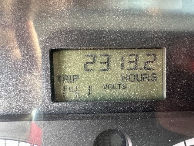 Dashboard display showing 2313.2 hours, TRIP 144.1, VOLTS label on a digital gauge.