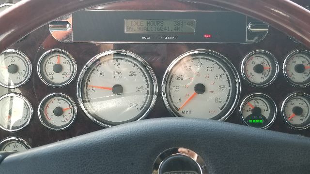 Dashboard view of a 2013 Freightliner Coronado 132 showing multiple gauges, including RPM, speedometer, and digital readout on center panel.