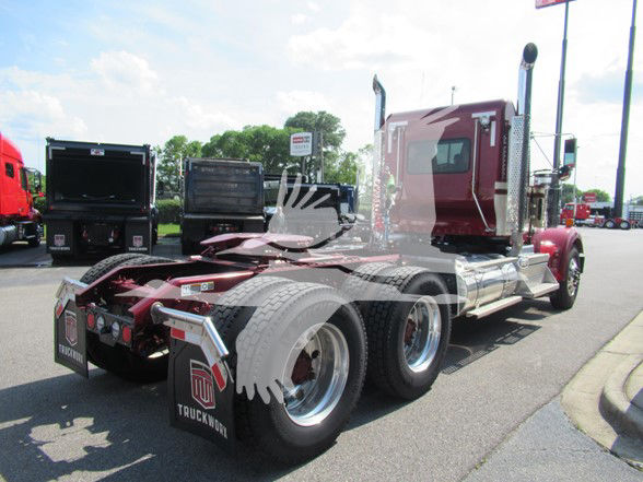 Kenworth W900L conventional daycab truck rear and side view with dual rear axles and chrome exhaust stacks.