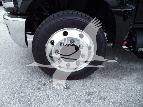 Truck wheel showing steel hubcap and Goodyear tire on Silverado 6500HD.