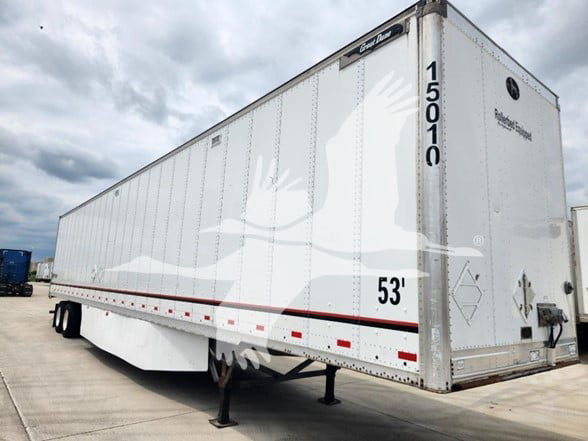 Great Dane trailer side and rear showing 53' length and white exterior with logo and reflective tape.
