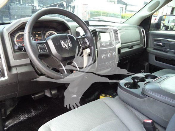 Ram 4500 interior showing steering wheel, center console, and dashboard from driver’s side.