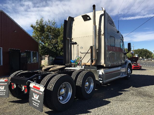 2012 Peterbilt 578 conventional sleeper tractor with dual rear axles, side exhaust, and aluminum wheels. VIN 1XP4D49X5CD133538, stock number 72337 shown on listing info.