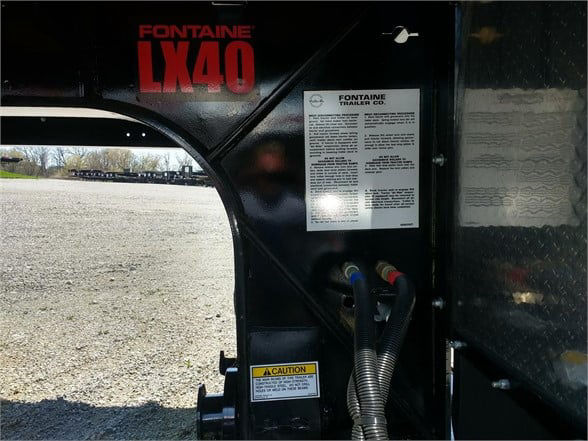 Fontaine LX40 40-ton mechanical detachable double drop trailer with label area and hoses visible on the side.