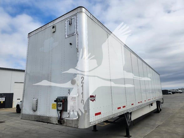 Wabash 2021 cargo trailer side view showing silver aluminum exterior and rear doors, VIN 1JJV532D8ML246170, stock 2110-2116.