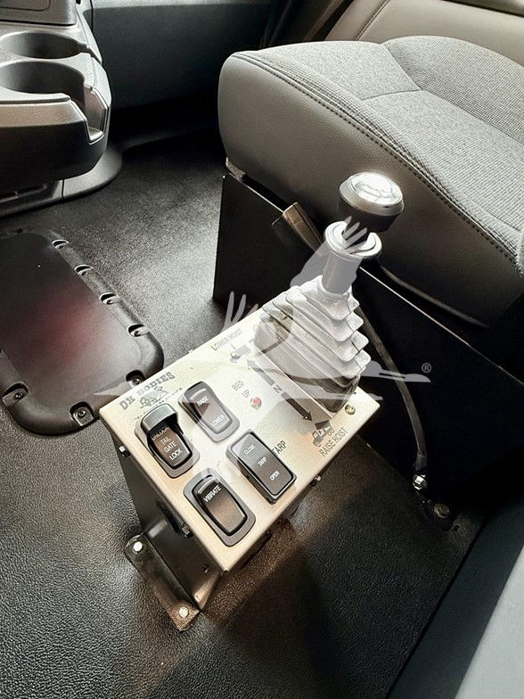 Kenworth T880 interior gear shifter and control panel with multiple switches and a tall shift lever.