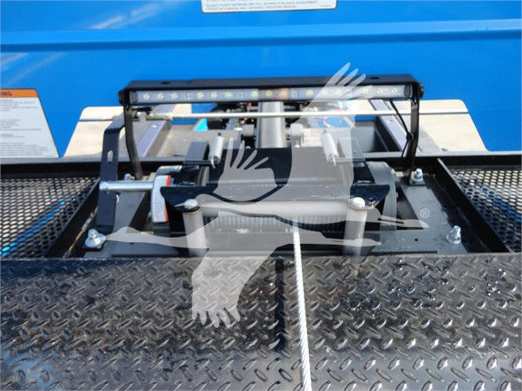 Peterbilt 337 tow truck component with hydraulic lift mechanism and diamond plate step.