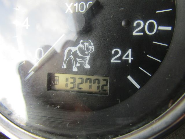 Mack gauge cluster showing speedometer with odometer reading 132792 miles and a bulldog logo.