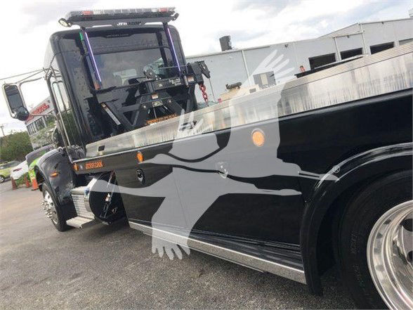 2022 Peterbilt 337 tow truck showing side view with black paint and chrome trim, stock number STEPSIDE337SRS visible.