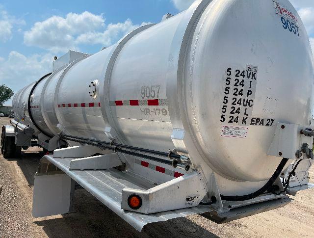 Aluminum DOT-407 crude oil tanker trailer with rear view showing cylindrical tank and support frame, markings 5 24VK 5 24I 5 24P on end cap.