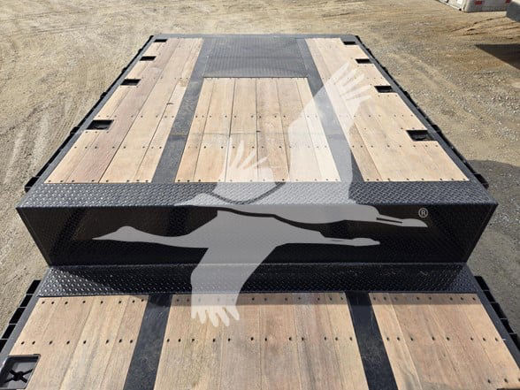 Drop deck trailer with wood plank deck and steel frame, TRI-axle, black frame with diamond plate edges.