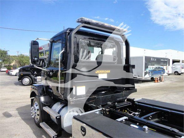 Mack MD6 tow truck cab rear view with chrome fuel tanks and steps, black body, 