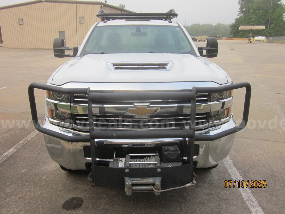 Chevrolet Silverado 3500HD front view showing grille guard and winch mounted on bumper.