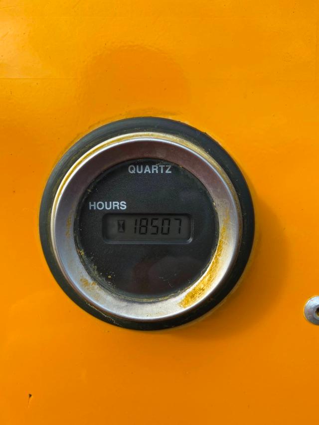 Hour meter labeled QUARTZ showing 18507 hours on an orange industrial machine surface.