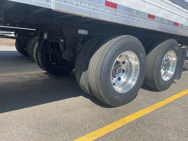 Great Dane trailer wheels and tandem axles under a 53' x 102" reefer trailer in disc brake configuration.