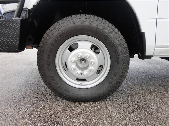 Vehicle wheel and tire on a Ram 3500 dump truck showing Toyo open country tire and steel rim.