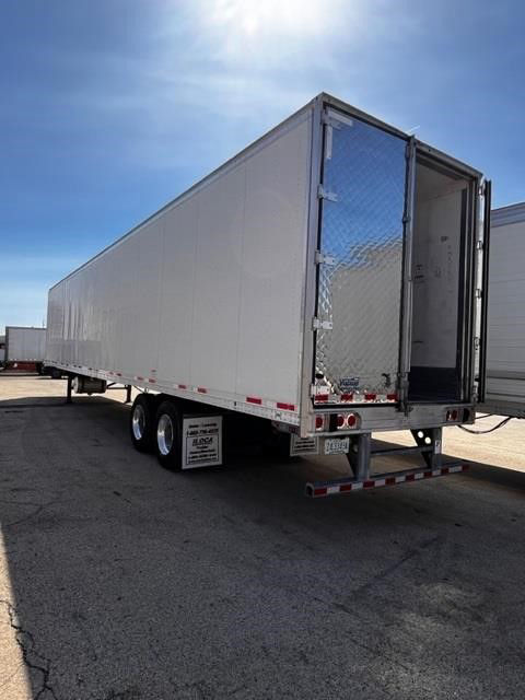 CIMC Cool Globe reefer trailer side and rear open doors showing aluminum exterior and tandem axles.